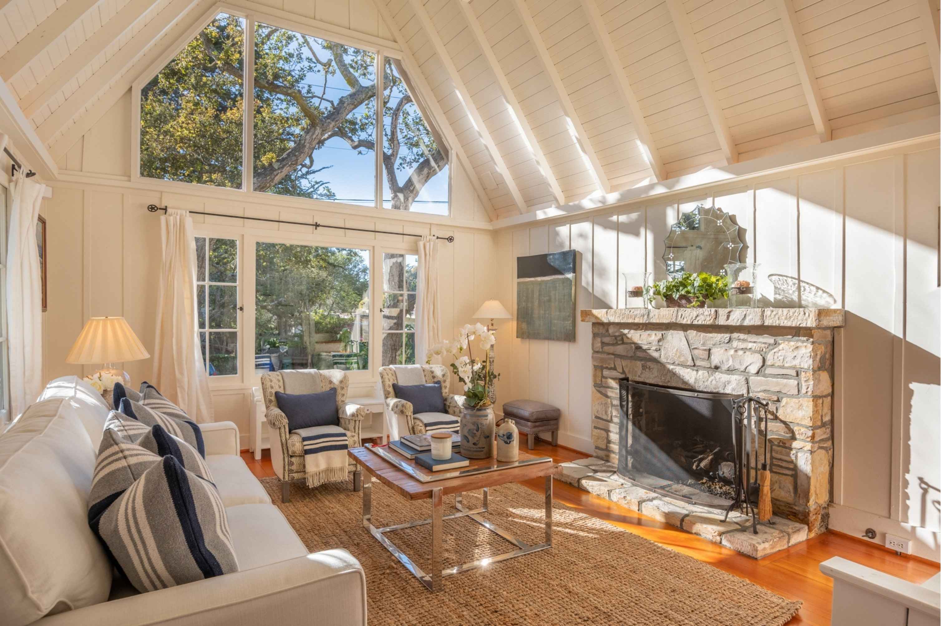 Beautifully staged living room with neutral décor and natural light in a Carmel home