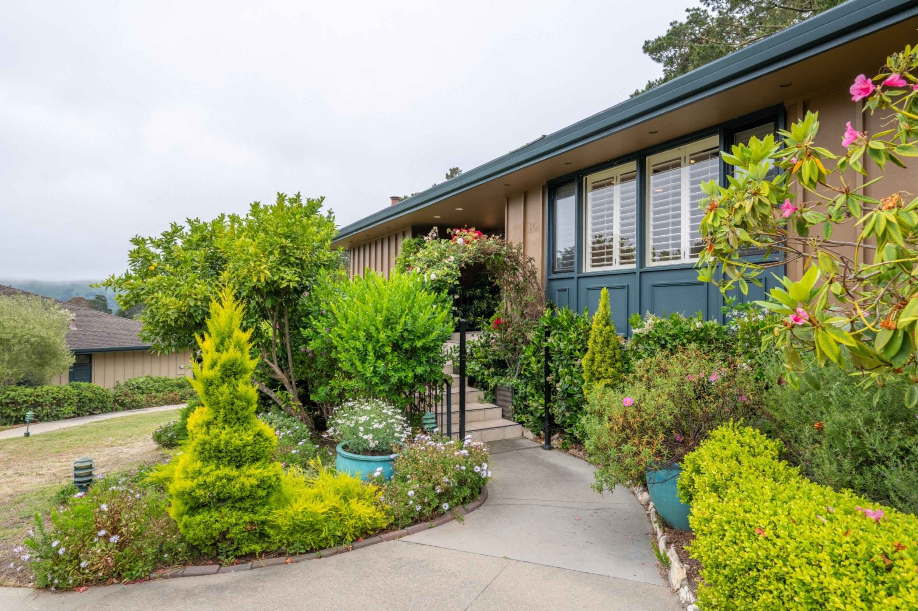 Sunset beach in Carmel-by-the-Sea during Memorial Day weekend with coastal homes nearby