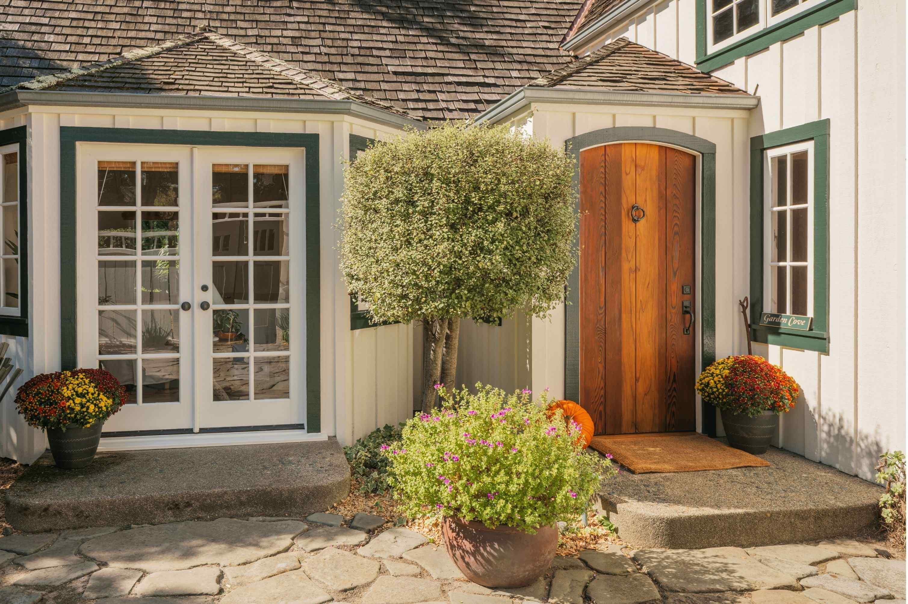 Busy summer afternoon in downtown Carmel-by-the-Sea with coastal homes nearby