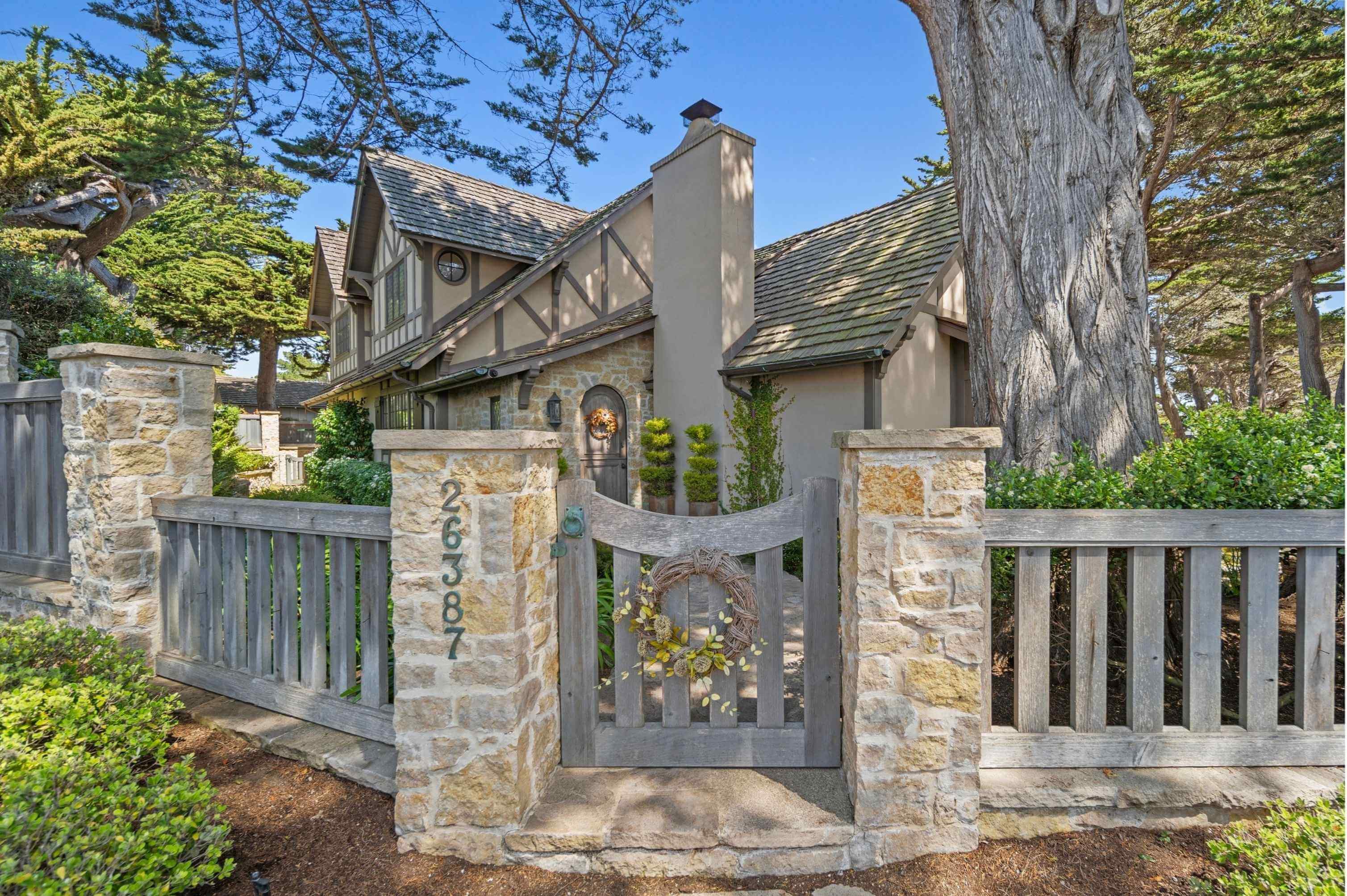 Pebble Beach coastline with luxury homes and golf course views under clear skies