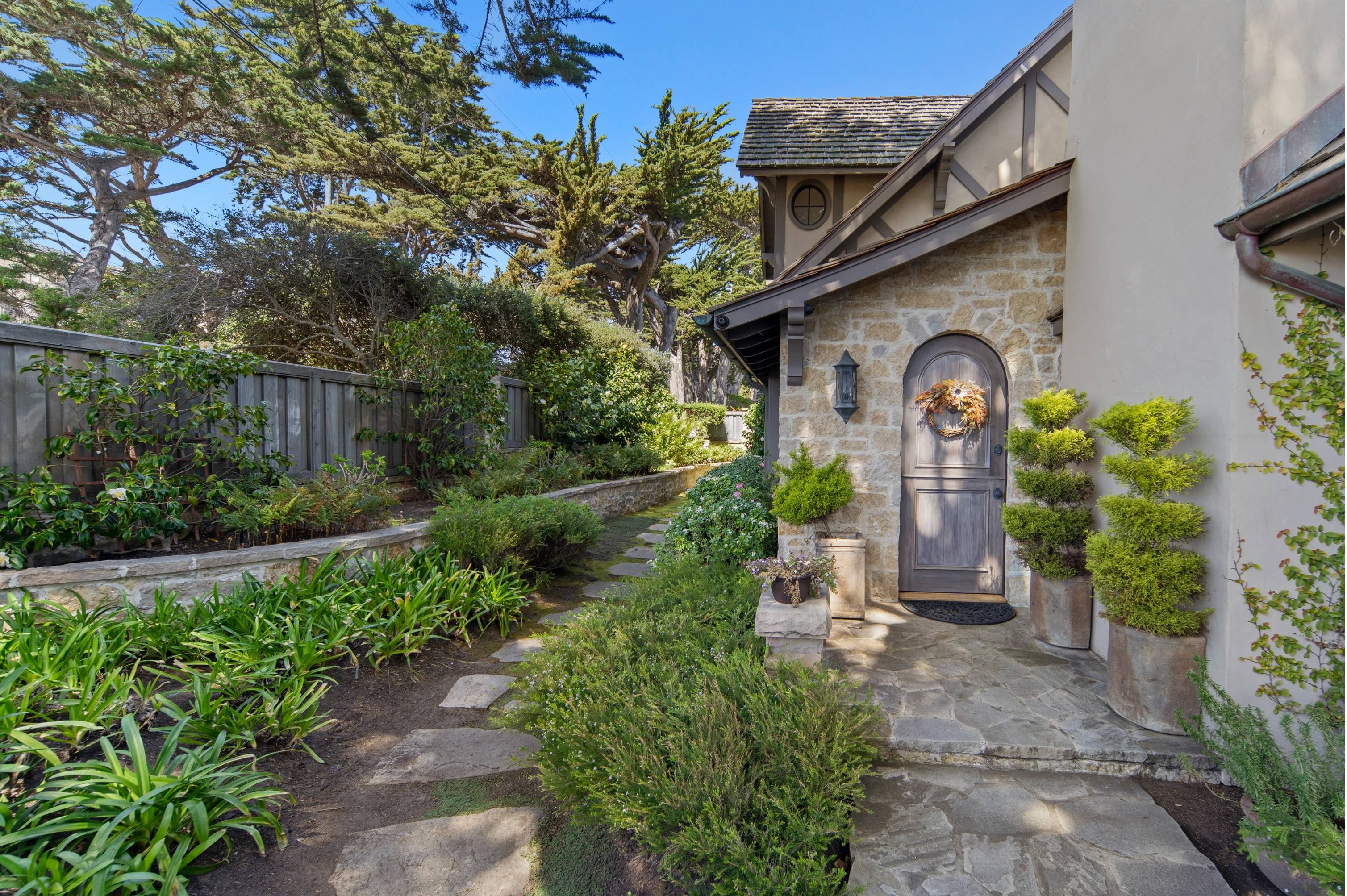 Ocean-view home in Carmel with spring sunlight over the Monterey Peninsula coastline