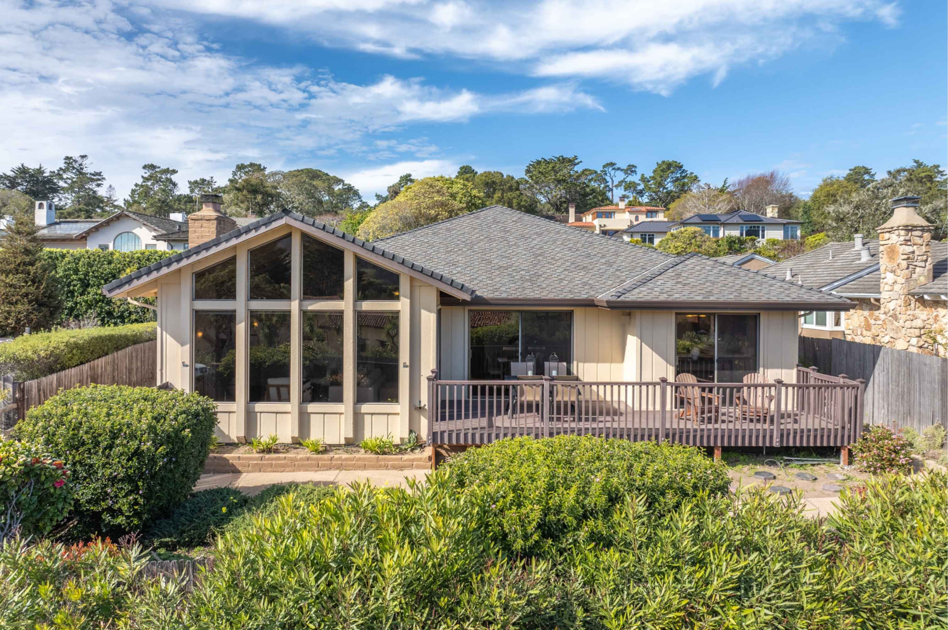 Pebble Beach golf course during AT&T Pro-Am week with luxury coastal homes nearby