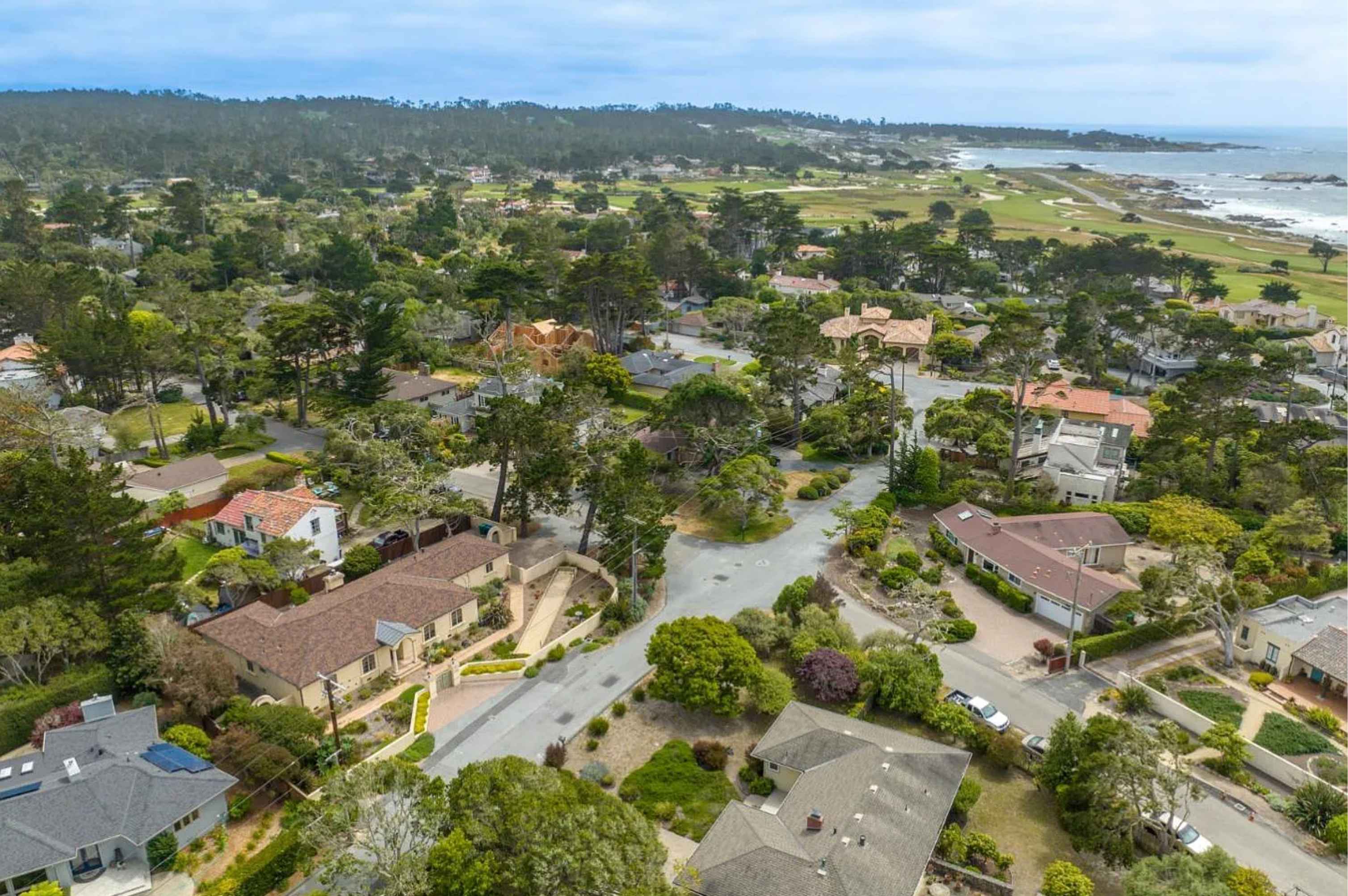 An iconic Pebble Beach estate overlooking the coastline, embodying the world-class lifestyle of the AT&T Pro-Am.
